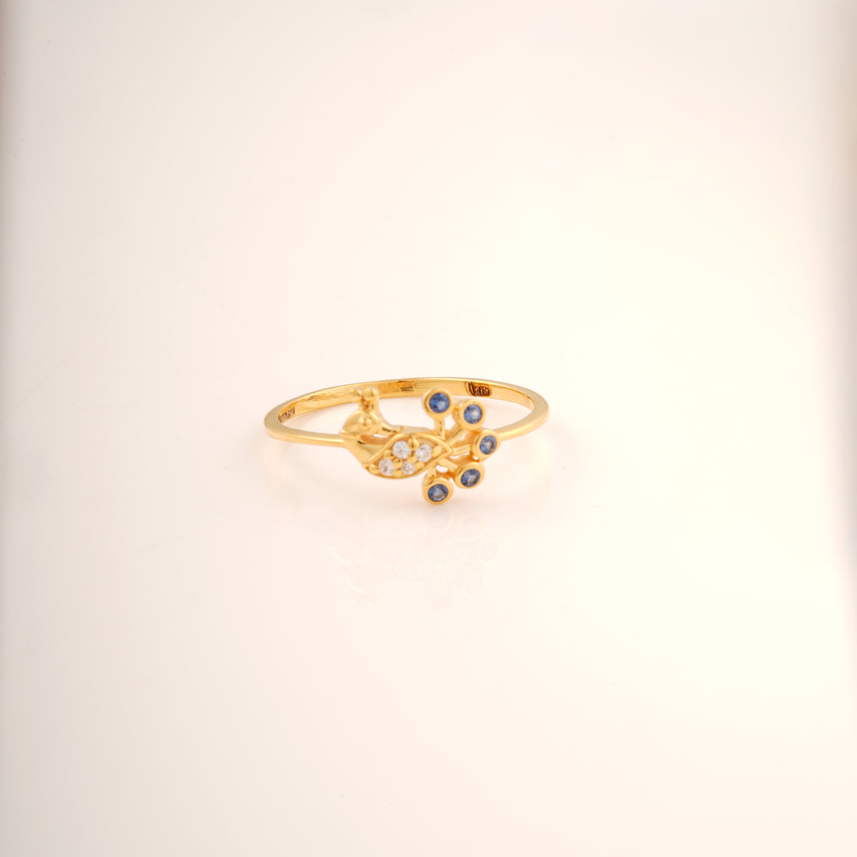 18KT gold peacock ring with diamond body and blue gemstone accents