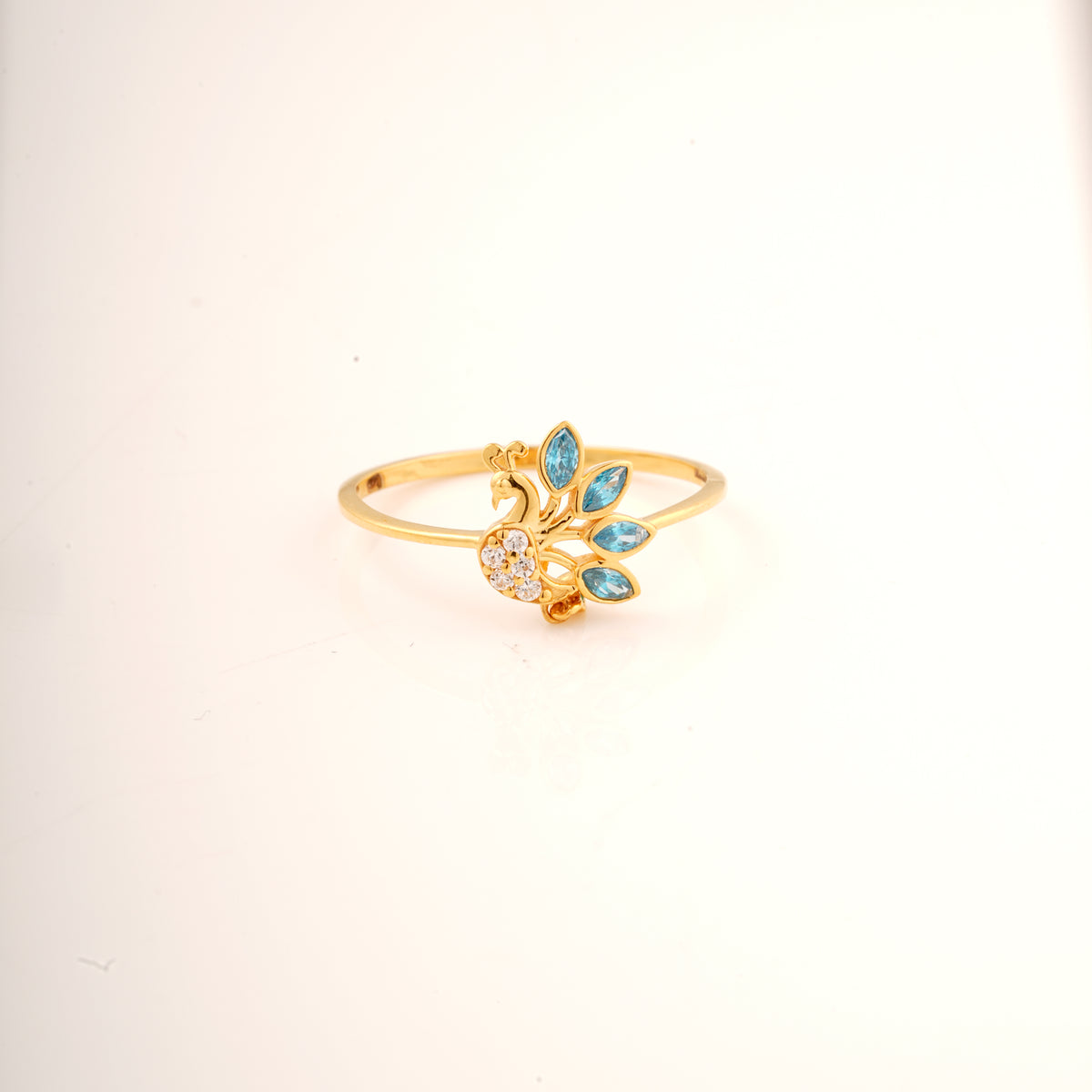 18KT gold ring with peacock design and blue gemstone feathers