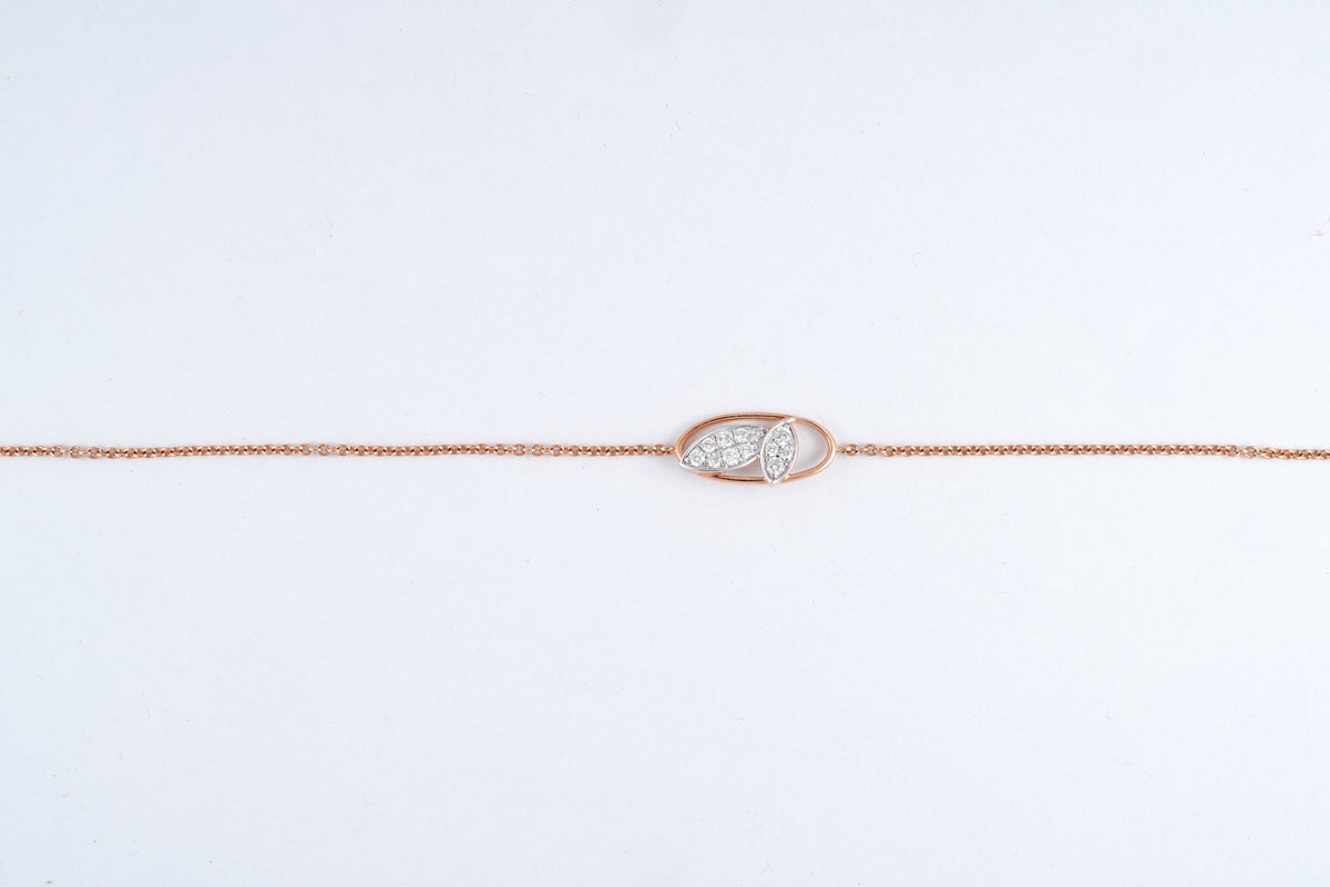 18KT rose gold bracelet with diamond leaf design in oval frame