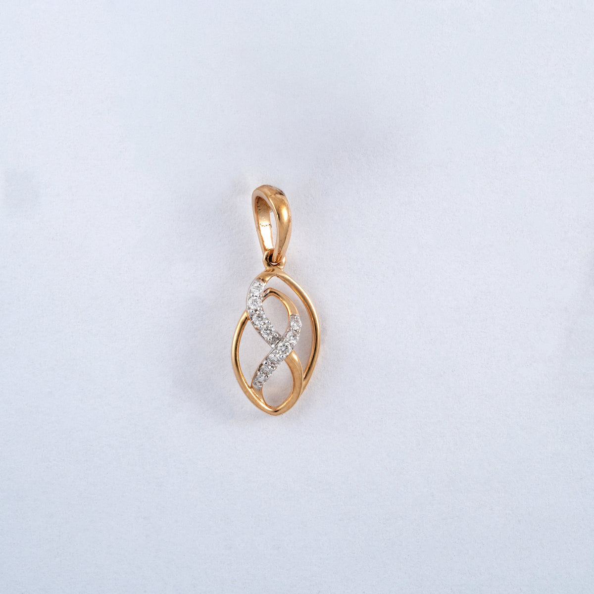18KT gold pendant with diamond infinity design in oval frame