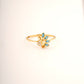 18KT gold ring with peacock design and blue gemstone feathers