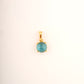18KT gold pendant with round blue gemstone in claw setting