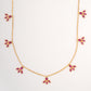 18KT gold necklace with pink gemstone leaf shaped charms