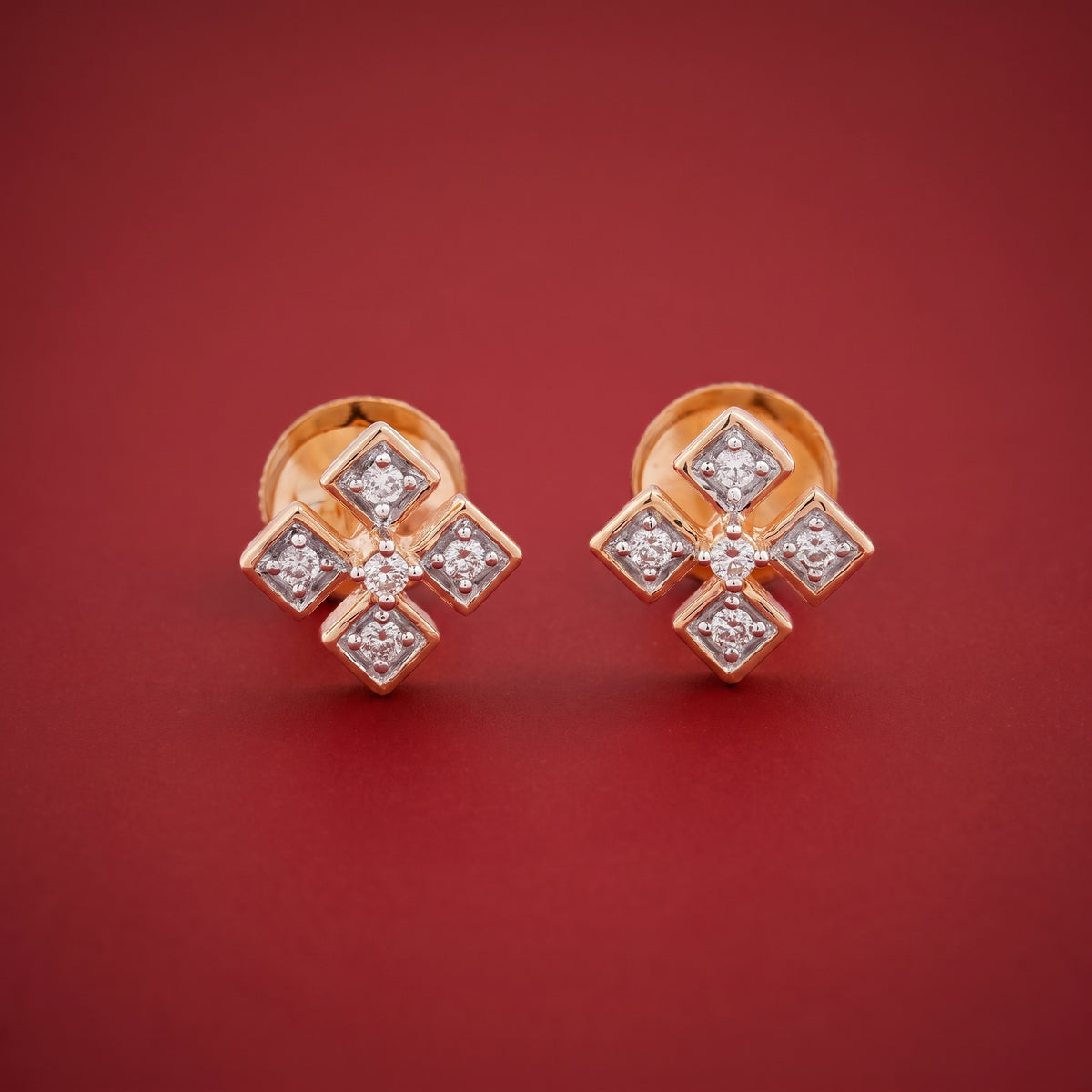 18KT rose gold diamond stud earrings in a cross motif