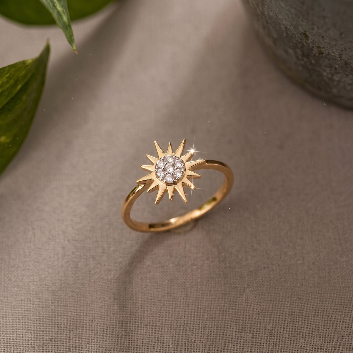 18KT gold diamond ring with sunburst design and pave centre