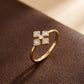 18KT gold diamond ring with clover shaped motif on band