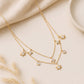 18KT gold diamond necklace with layered chains, sunburst and kite charms