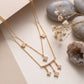 18KT gold diamond necklace with bar and kite shaped tassel charms