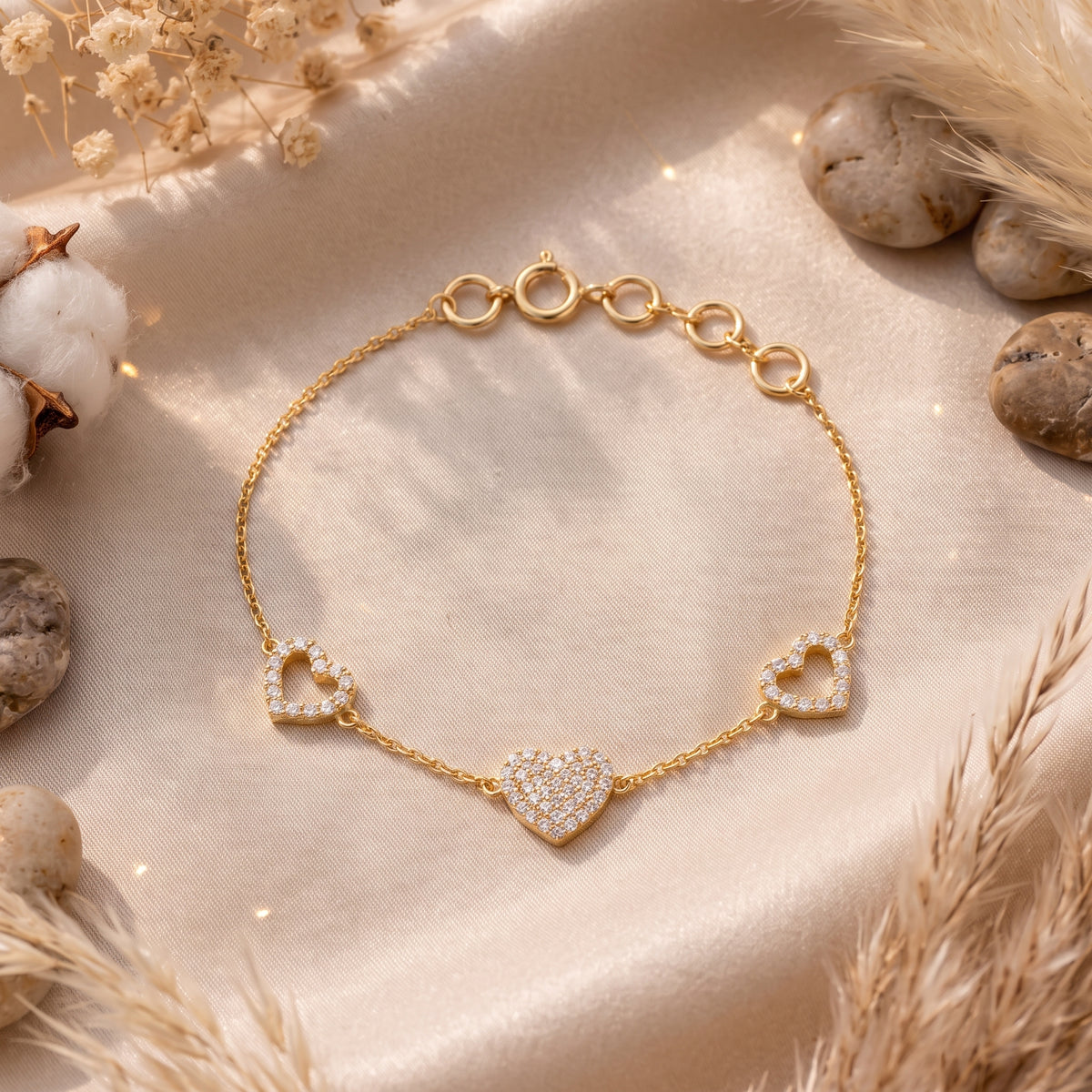 18KT gold diamond bracelet with three heart charms, one pave and two outline