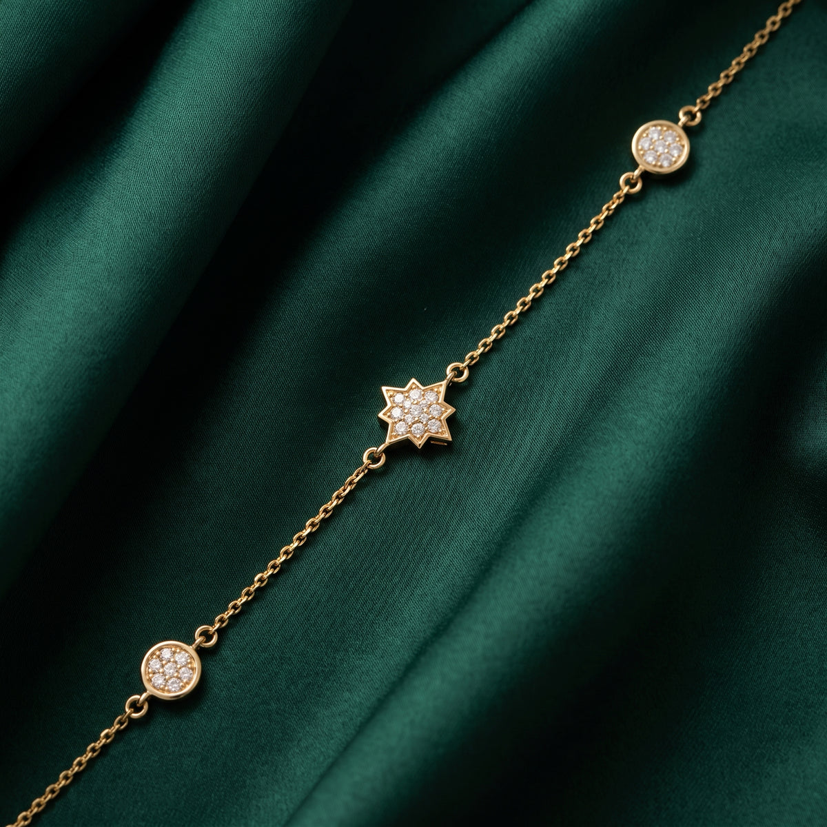 18KT gold diamond bracelet with star motif and round diamond Charms