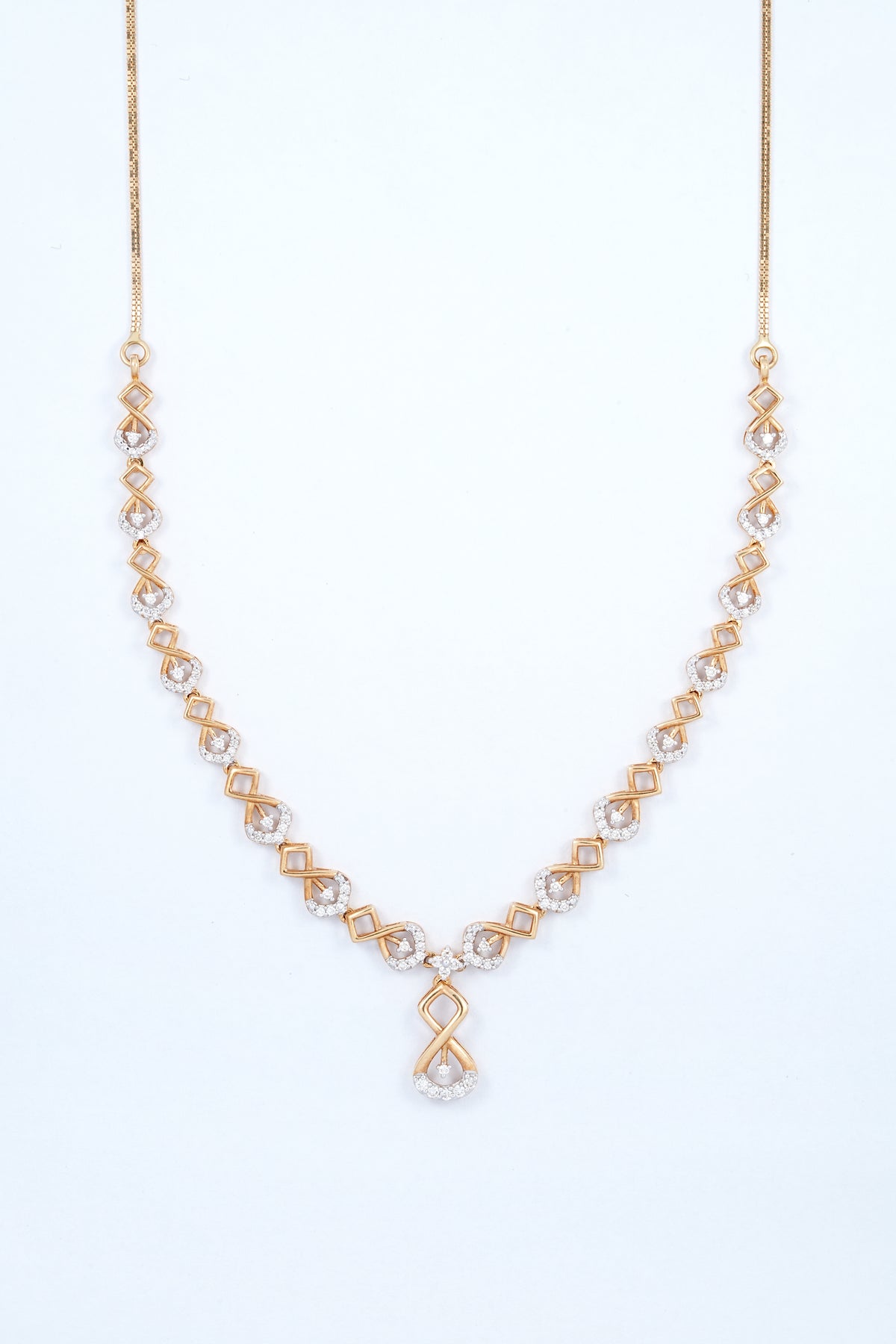 18KT rose gold diamond necklace with interlocking links and infinity drop