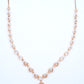 18KT rose gold diamond necklace with swirl link design
