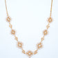 18KT gold diamond necklace with starburst clusters and drop pendant