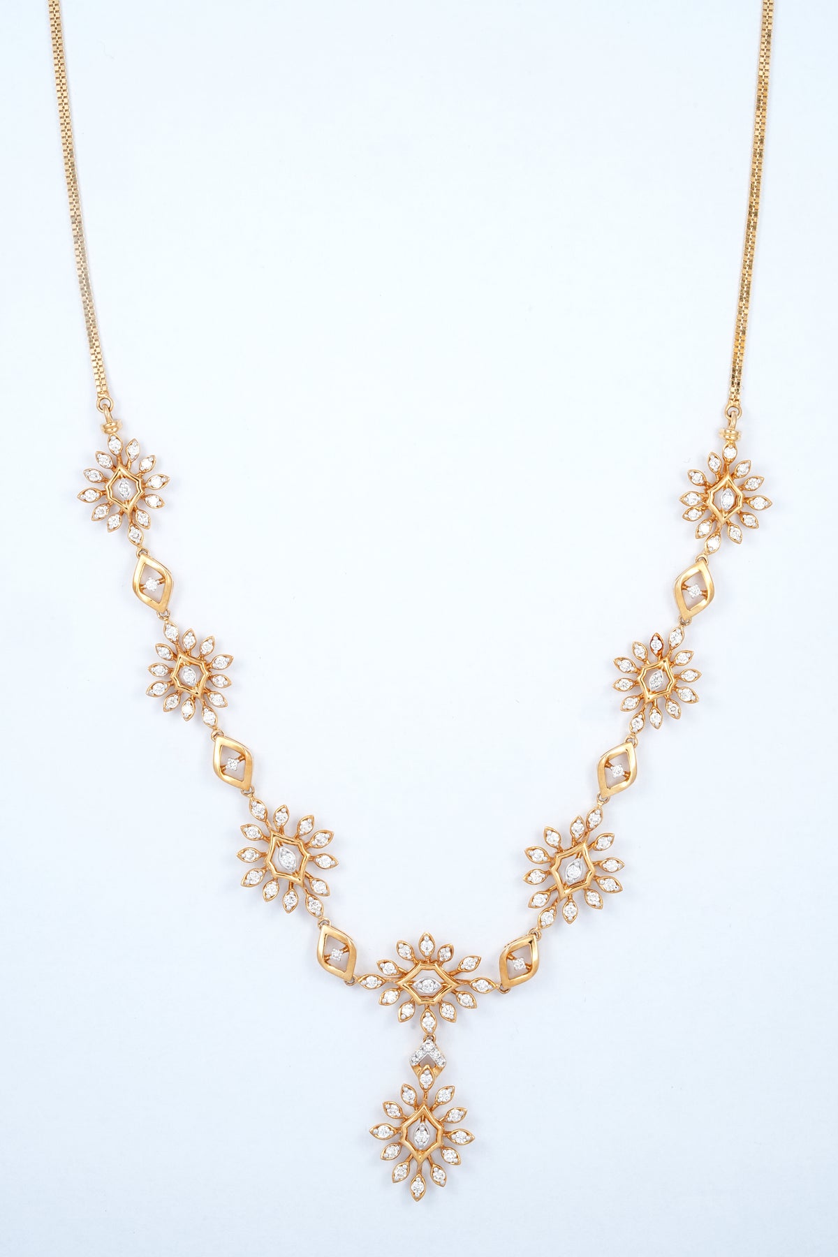 18KT gold diamond necklace with starburst clusters and drop pendant