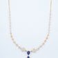 18KT rose gold diamond necklace with blue gemstone drops and fan motifs