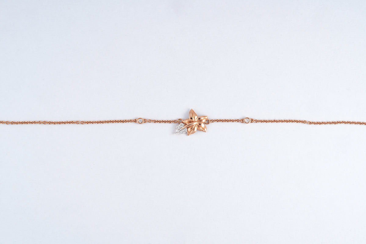 18KT rose gold bracelet with star flower charm and diamond accents