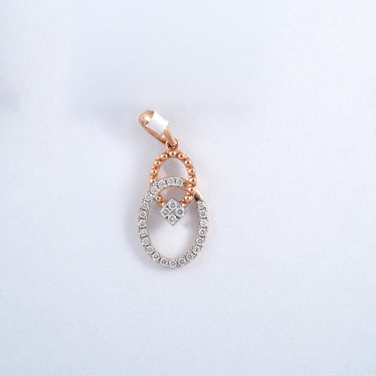18KT rose gold diamond pendant with interlinked oval design