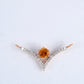 18KT rose gold pendant with amber gemstone and diamond chevron design