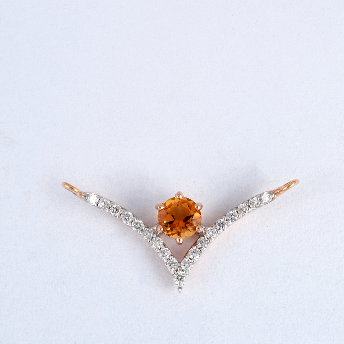 18KT rose gold pendant with amber gemstone and diamond chevron design