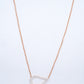 18KT rose gold diamond pendant in a sideways teardrop shape
