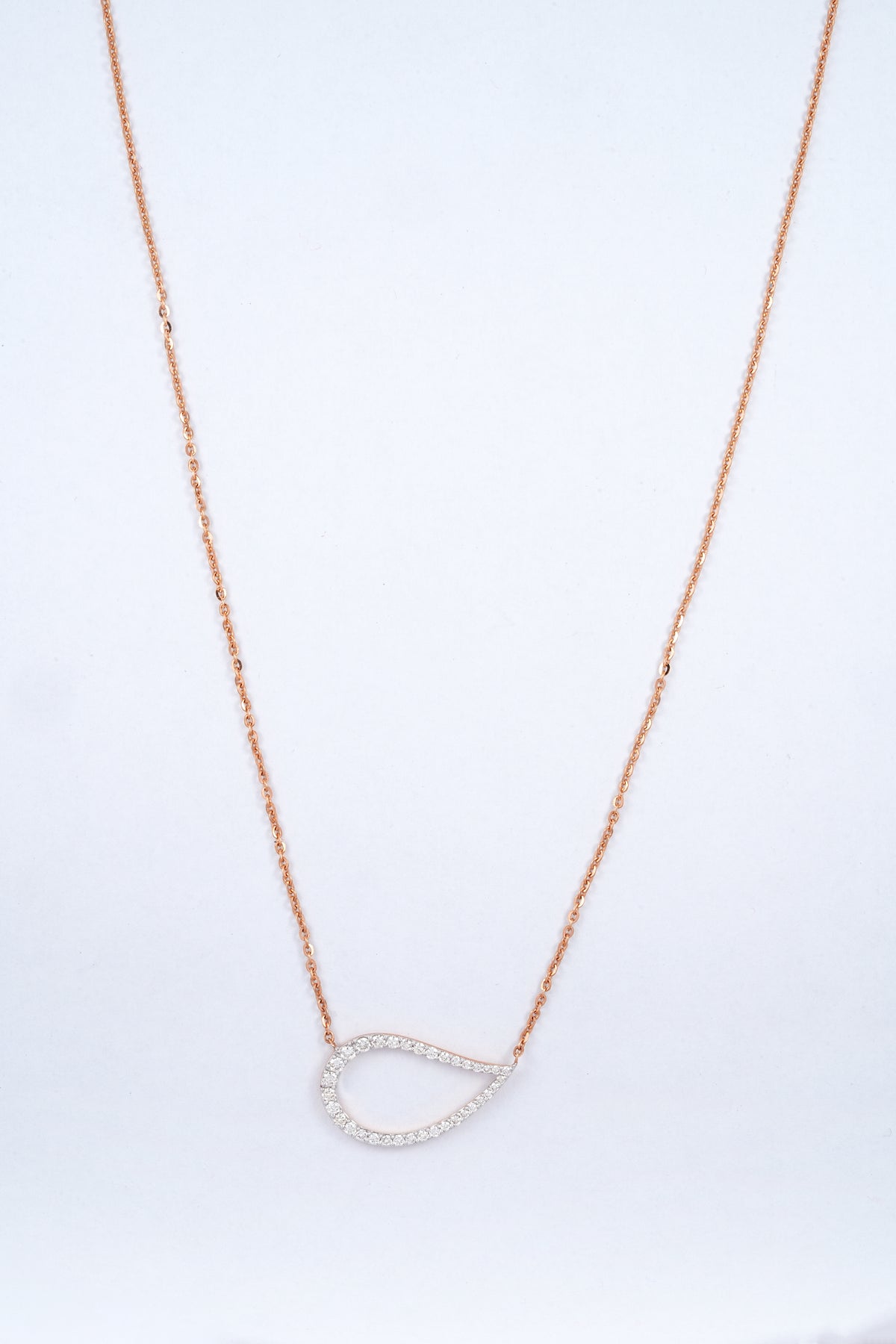 18KT rose gold diamond pendant in a sideways teardrop shape