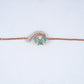 18KT rose gold bracelet with green gemstone cluster and diamond arc