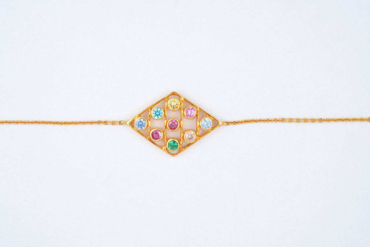 Yellow gold kite shaped bracelet with multi coloured gemstones, Lille by Challani